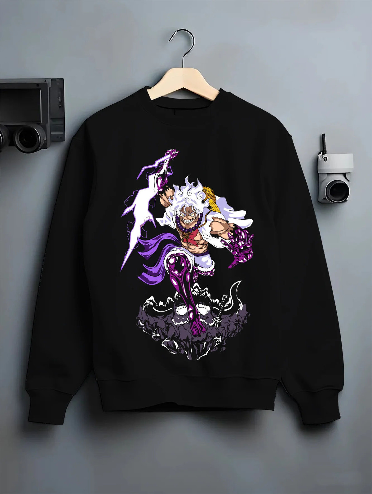 Black crewneck sweatshirt on hanger showing Monkey D. Luffy from One Piece: Gear 5 purple lightning