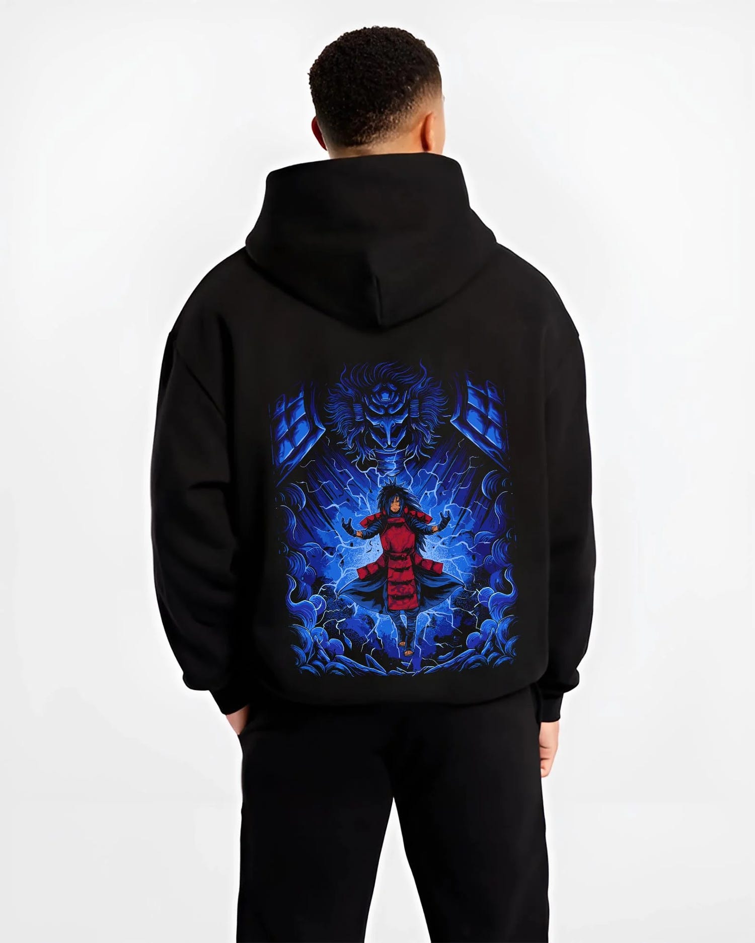 Black hoodie worn by male model, back view with Madara Uchiha Hoodie Naruto Legendary Power graphic bold anime graphic.
