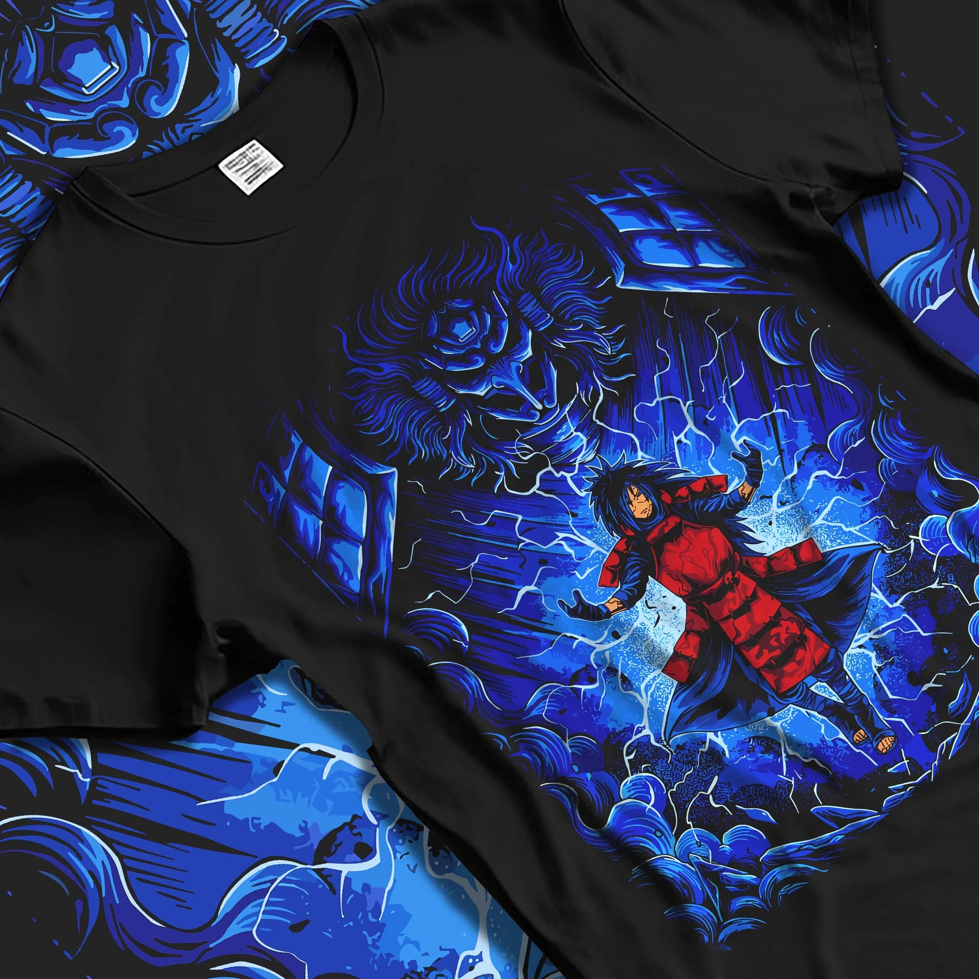 Black T-shirt laid flat with natural folds with Madara Uchiha Hoodie Naruto Legendary Power graphic bold anime graphic.