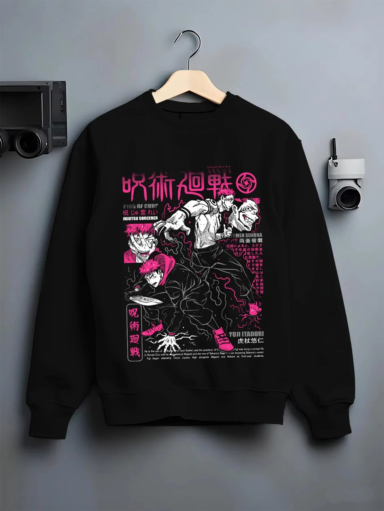 Black crewneck sweatshirt on hanger with Sukuna vs Yuji Hoodie Jujutsu Kaisen Epic Fight graphic bold anime graphic.