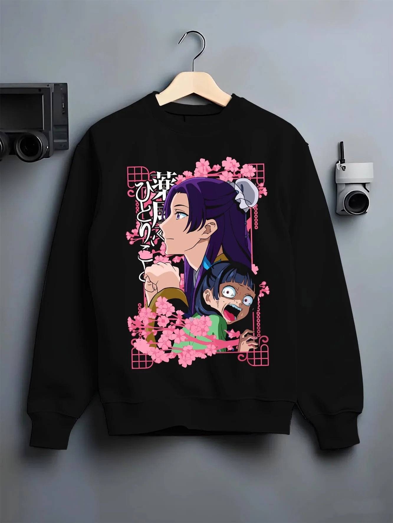 Black crewneck sweatshirt on hanger with Maomao Hoodie Apothecary Diaries Poison Tester Maid graphic streetwear graphic.