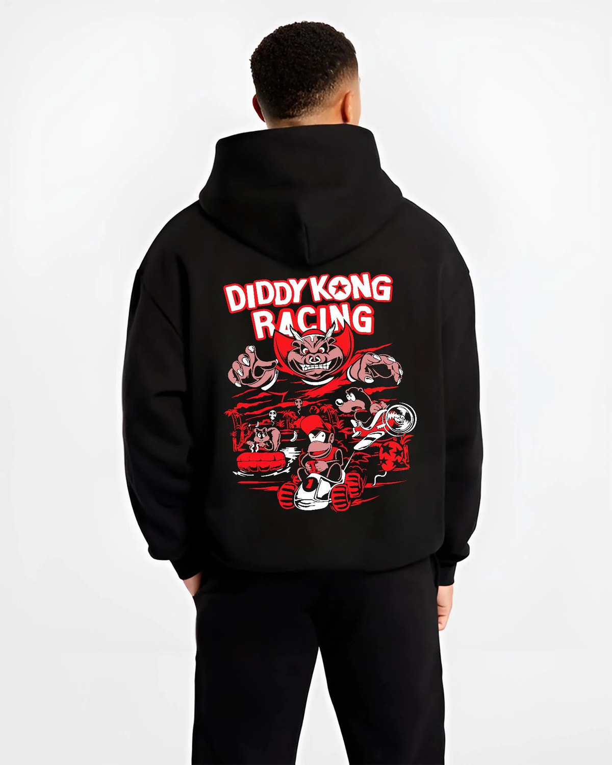 Black hoodie worn by male model from the back featuring Diddy Kong Racing kart action artwork.