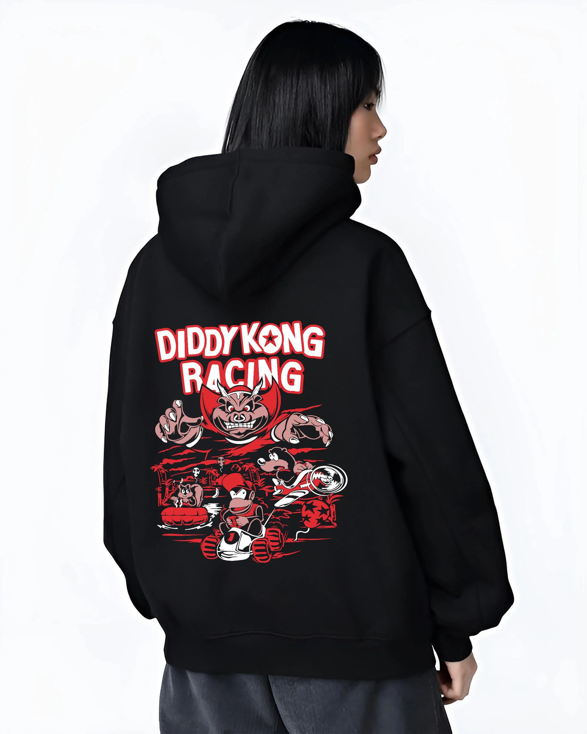 Black hoodie worn by female model from the back featuring Diddy Kong Racing kart action artwork.