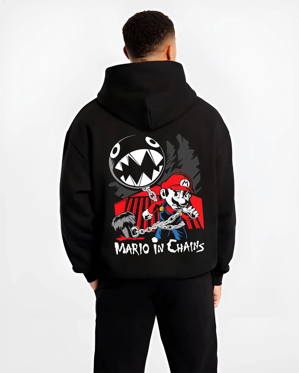 Black hoodie worn by male model from the back featuring Mario and Chain Chomp artwork.