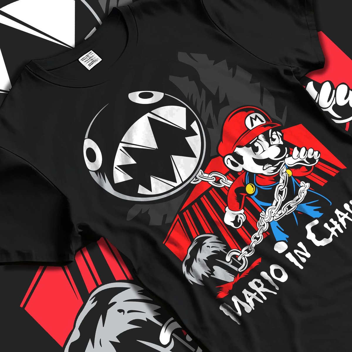 Black T-shirt laid flat with natural folds featuring Mario and Chain Chomp artwork.