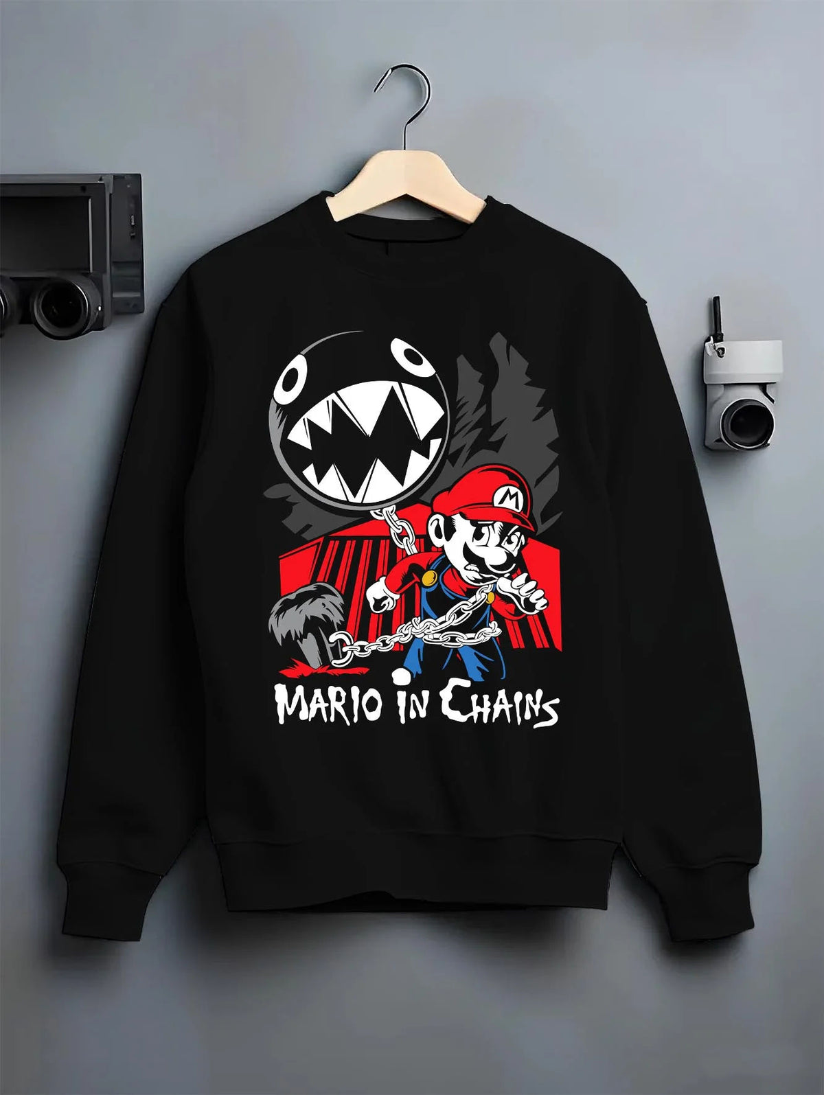 Black crewneck sweatshirt on hanger featuring Mario and Chain Chomp artwork.