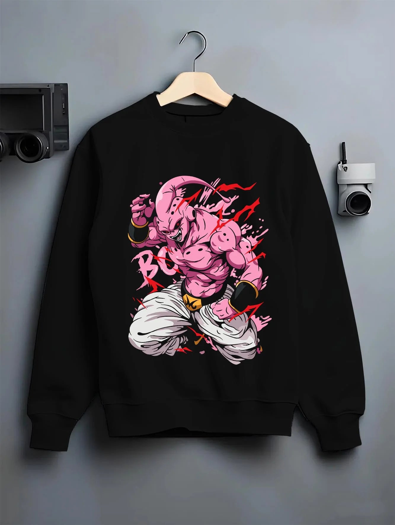 Black crewneck sweatshirt on hanger with Majin Buu Kid Hoodie Dragon Ball Z Chaos Power graphic bold anime graphic.
