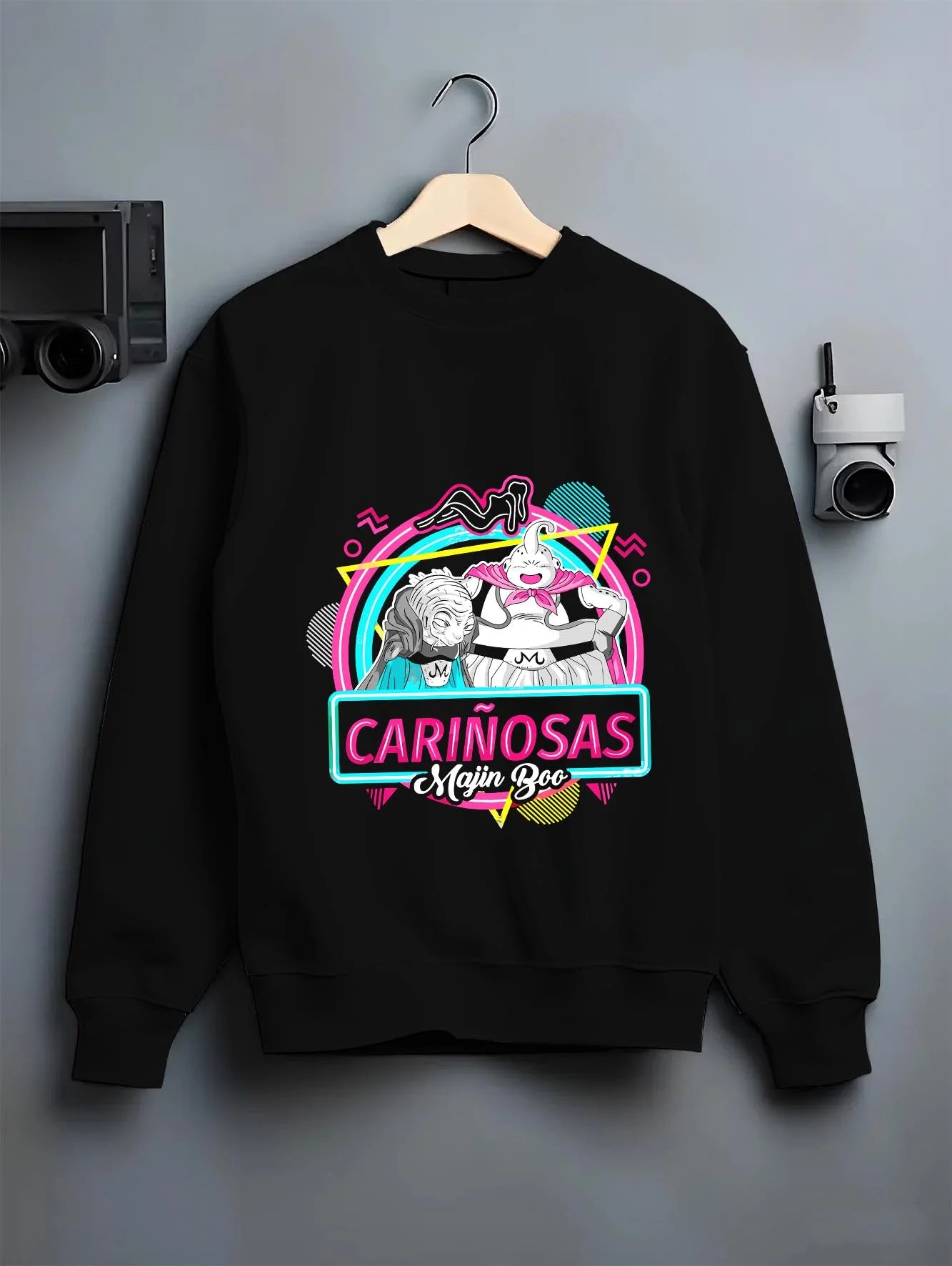 Black crewneck sweatshirt on hanger with Majin Buu Neon Hoodie Dragon Ball Z Carinosas graphic bold anime graphic.