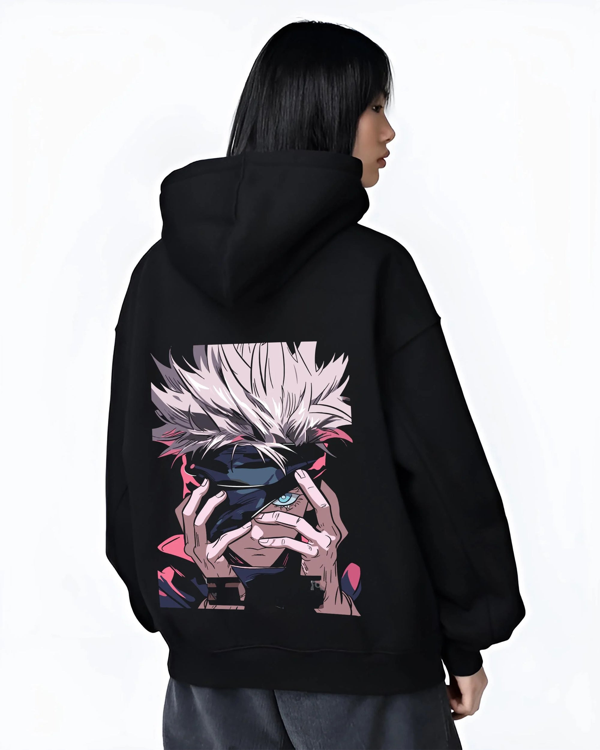 Black hoodie worn by female model, back view with Gojo Satoru Hoodie Jujutsu Kaisen Cursed Eyes graphic premium wear.