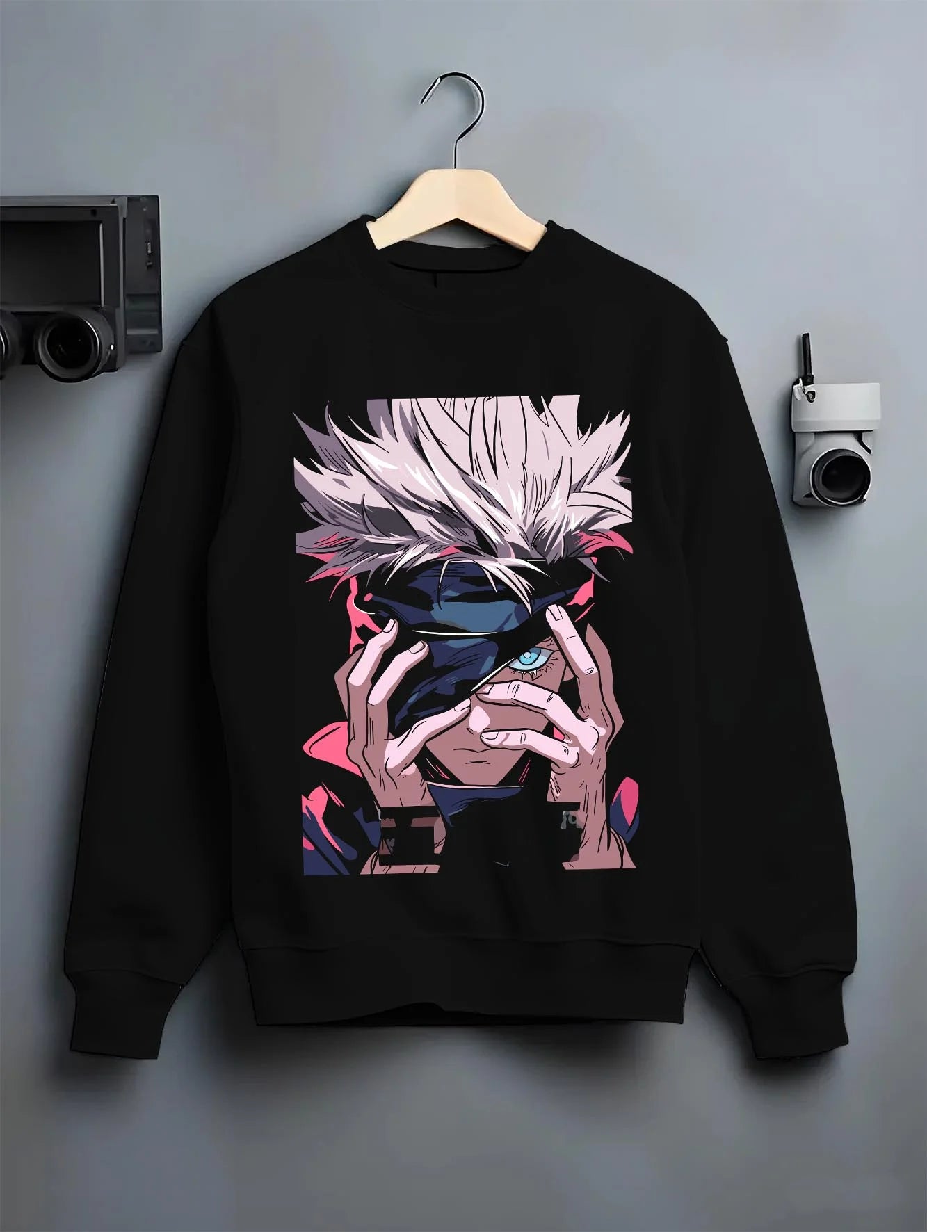 Black crewneck sweatshirt on hanger with Gojo Satoru Hoodie Jujutsu Kaisen Cursed Eyes graphic premium wear.