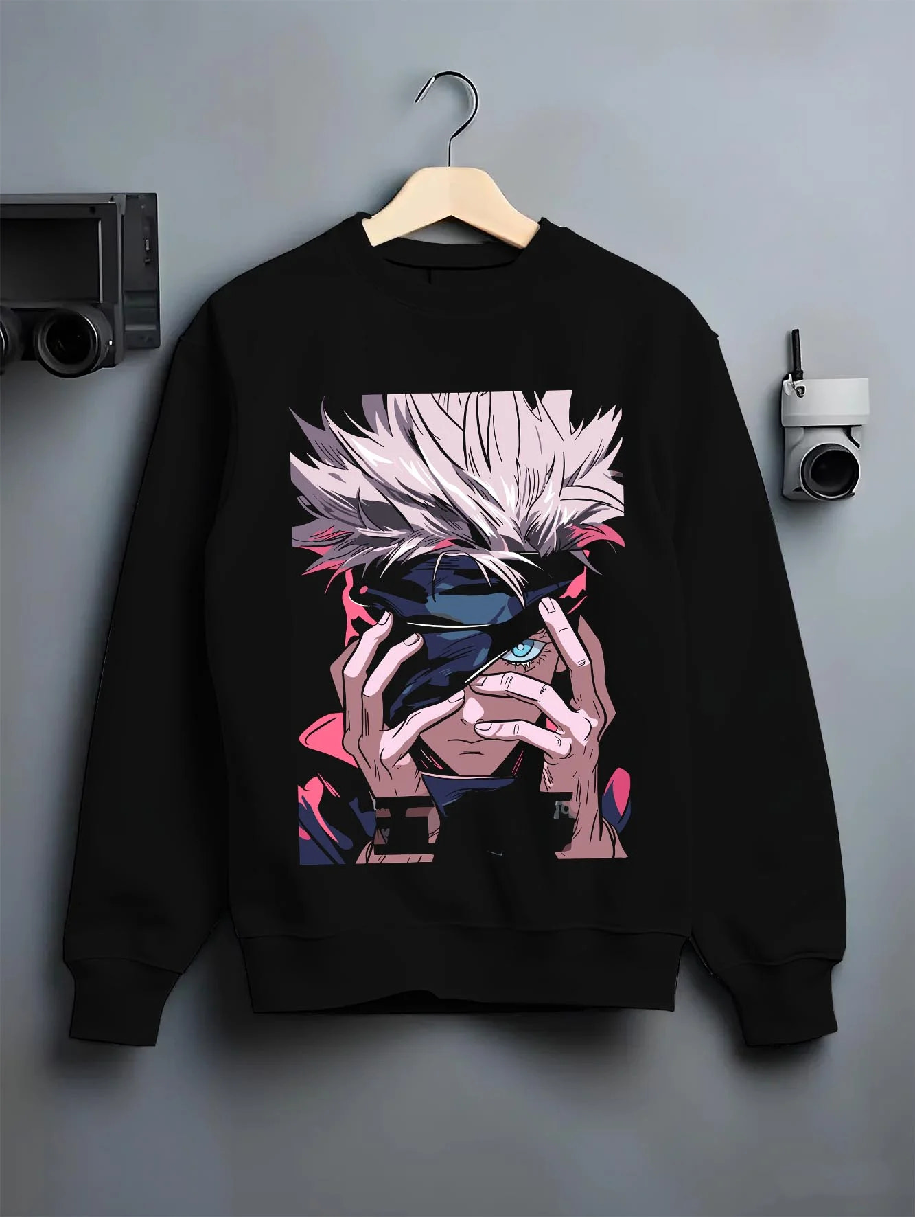 Black crewneck sweatshirt on hanger with Gojo Satoru Hoodie Jujutsu Kaisen Cursed Eyes graphic premium wear.