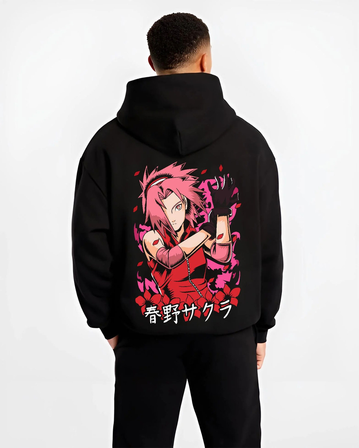 Black hoodie worn by male model from the back featuring Sakura Haruno medical ninja strength artwork.