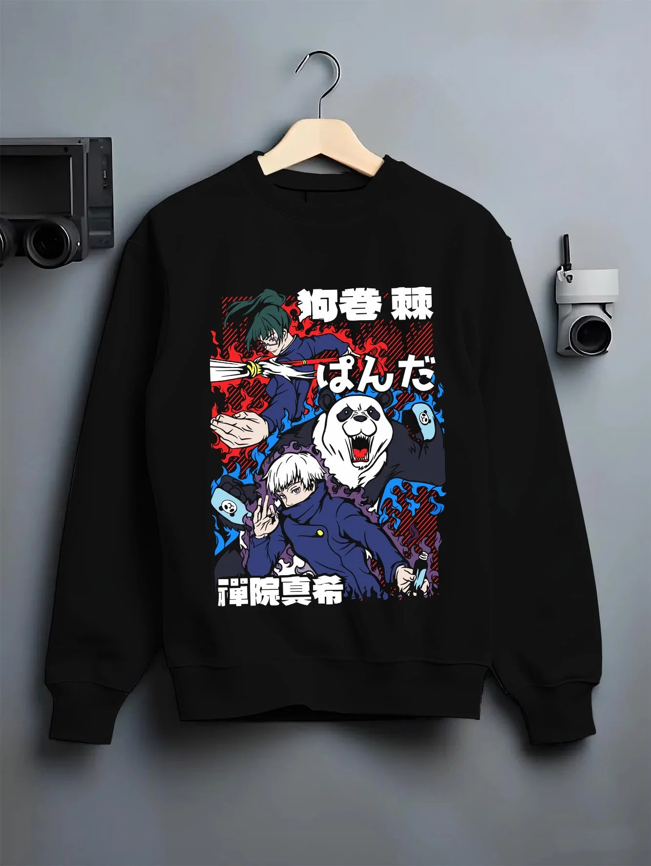 Black crewneck sweatshirt on hanger with Panda Hoodie Jujutsu Kaisen Fusion Scene graphic bold anime graphic.