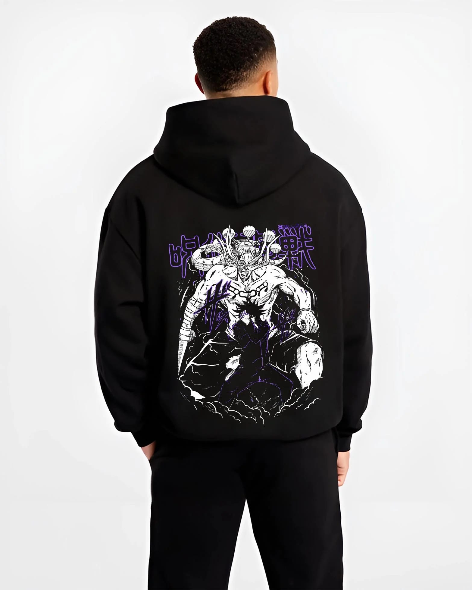 Black hoodie worn by male model, back view, showing retro manga graphic design of Mahoraga and Megumi in summoning pose.