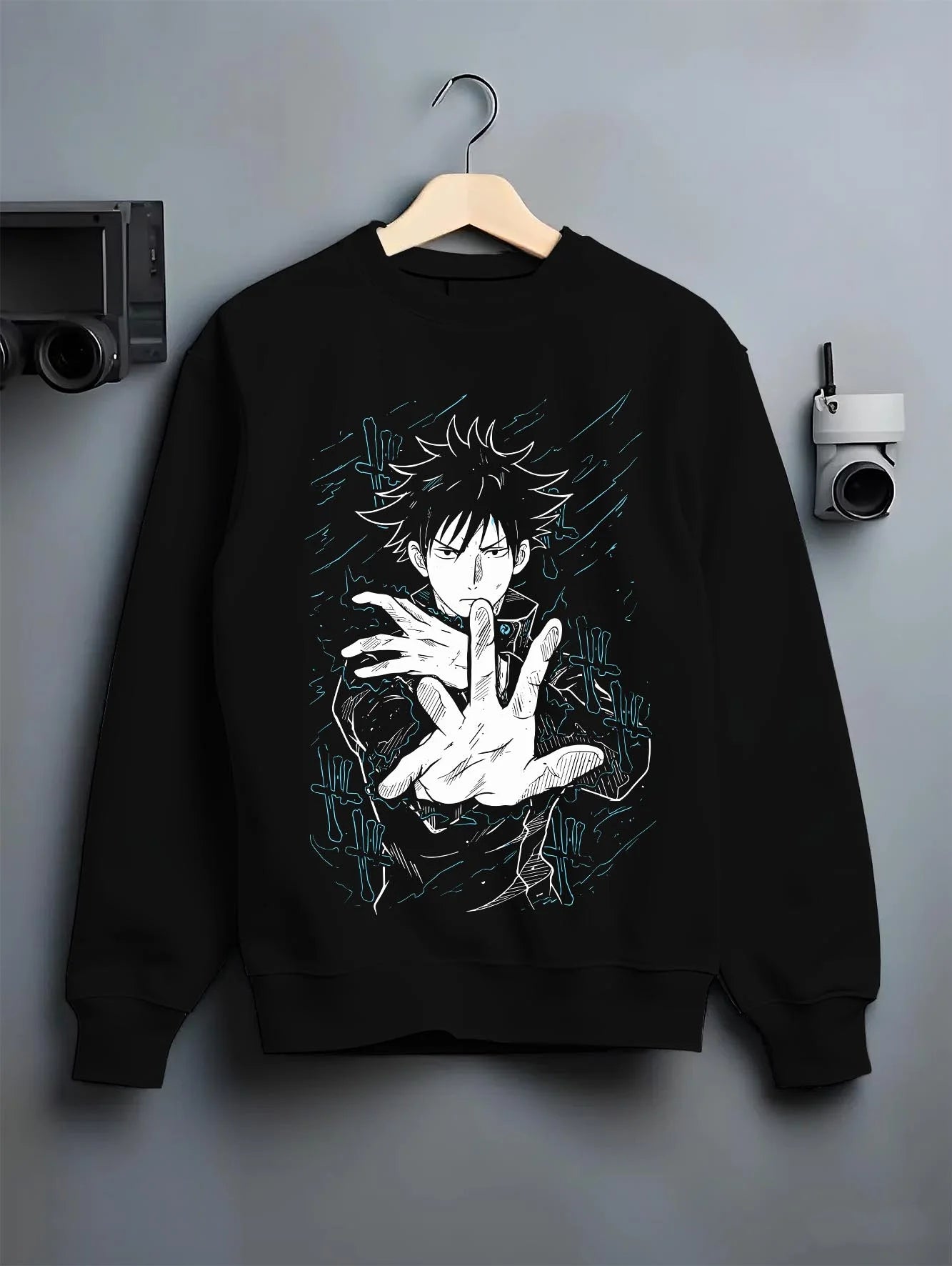Black crewneck sweatshirt on hanger with Megumi Fushiguro Hoodie Jujutsu Kaisen Shadows graphic bold anime graphic.