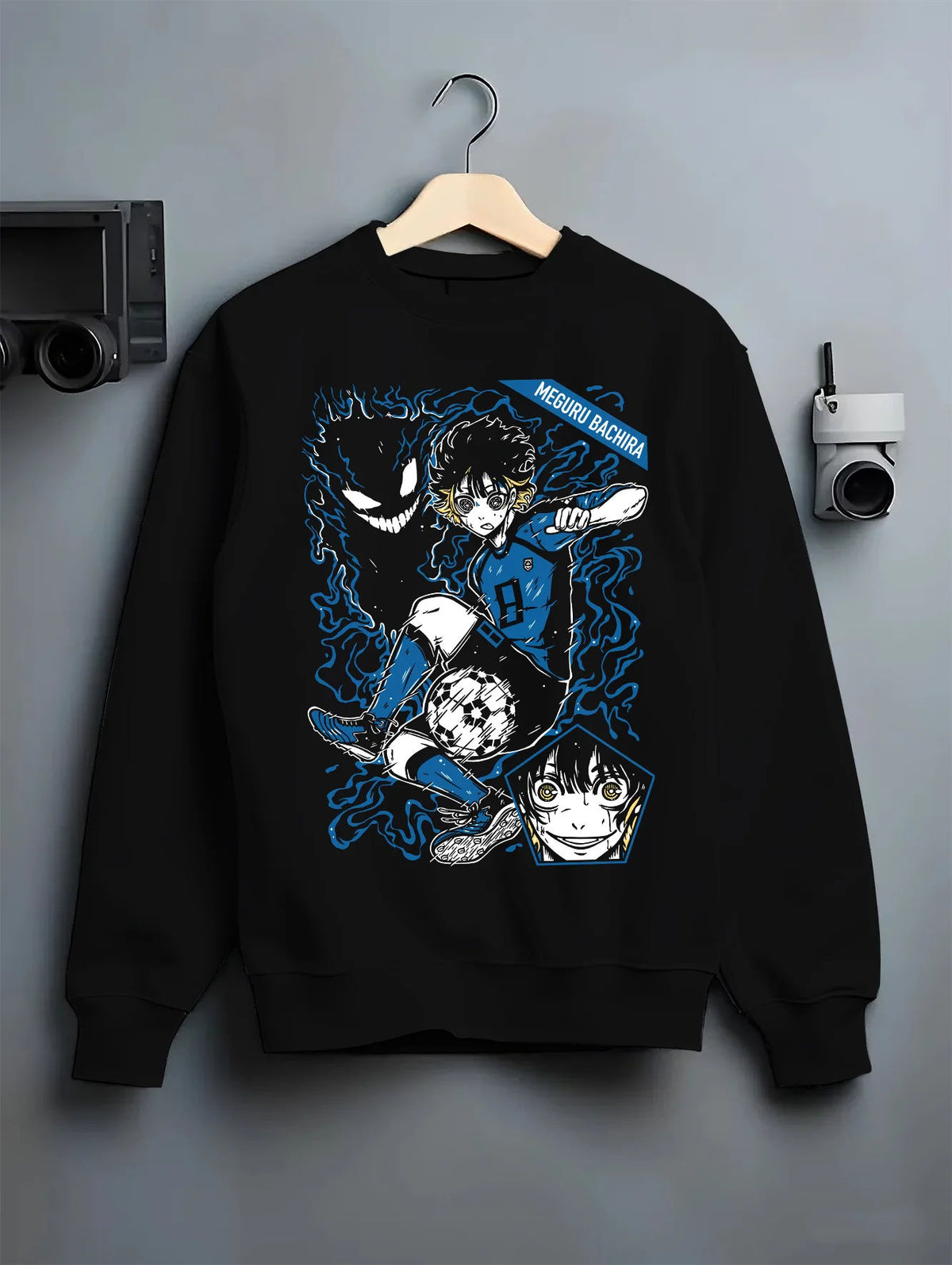 Black crewneck sweatshirt on hanger showing Meguru Bachira from Blue Lock: soccer player and aura composition