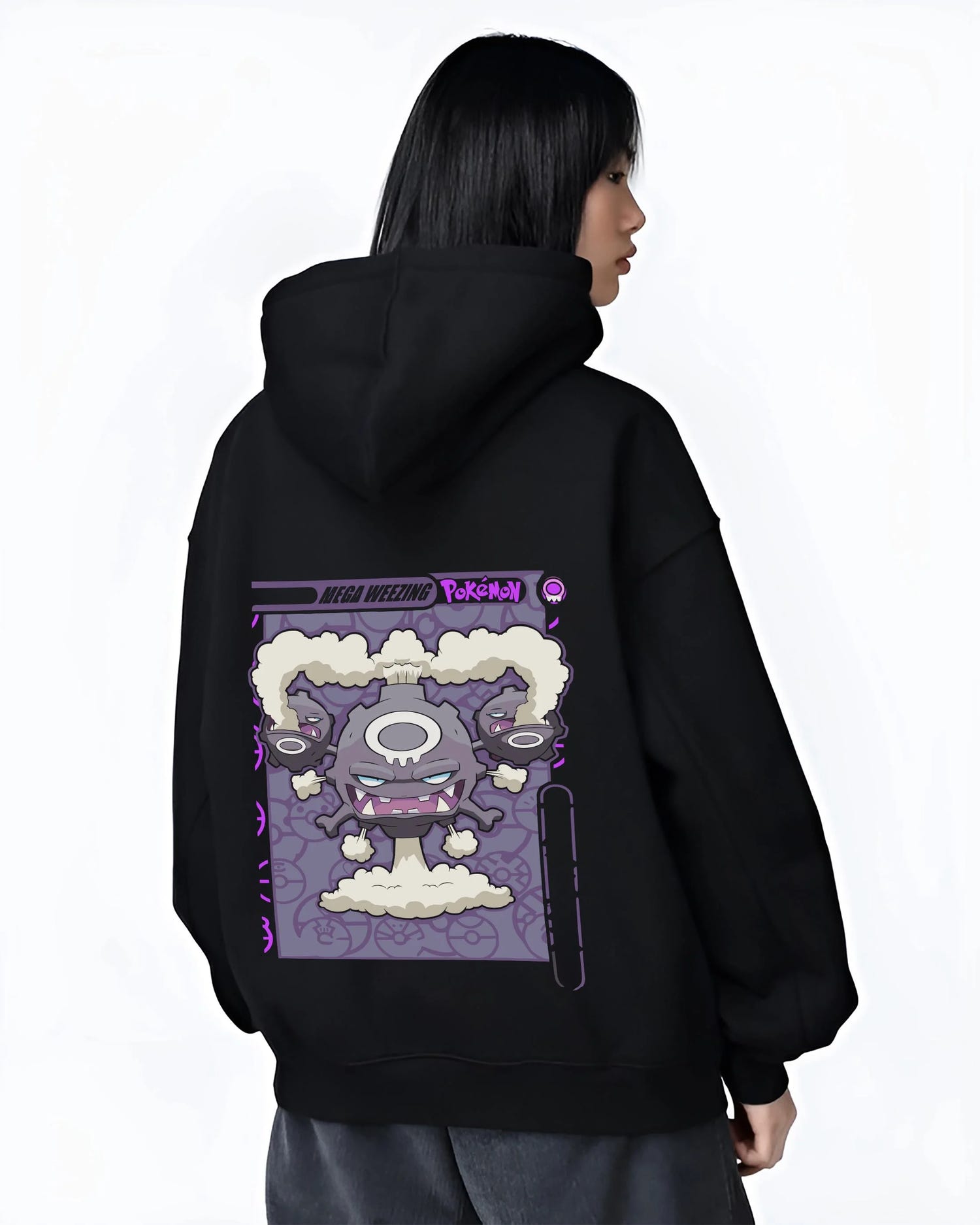 Black hoodie worn by female model, back view with Weezing Hoodie Pokémon Mega Evolution Card graphic bold anime graphic.