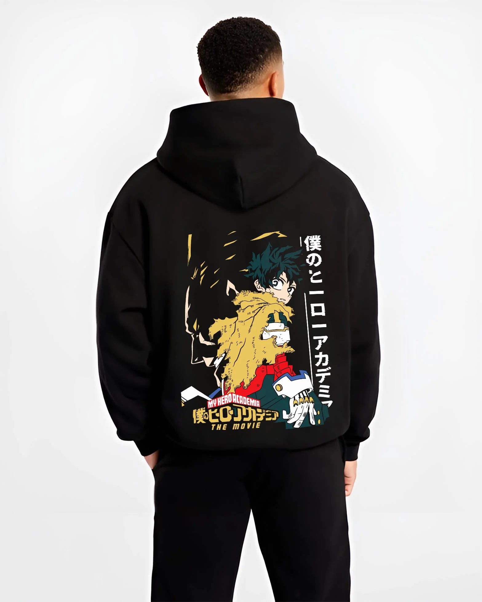 Black hoodie worn by male model, back view with Izuku Midoriya Hoodie My Hero Academia Movie graphic streetwear graphic.