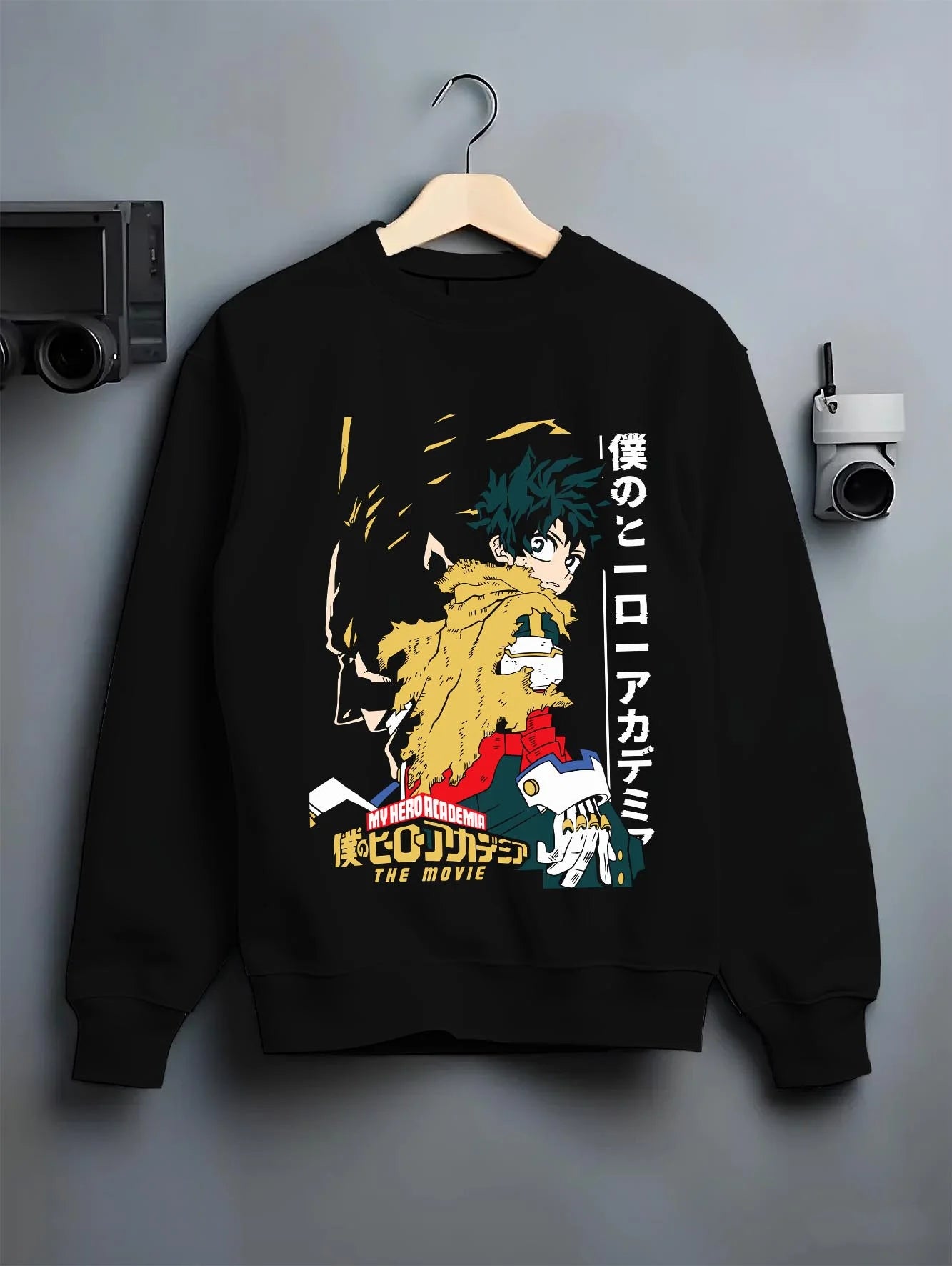 Black crewneck sweatshirt on hanger with Izuku Midoriya Hoodie My Hero Academia Movie graphic bold anime graphic.