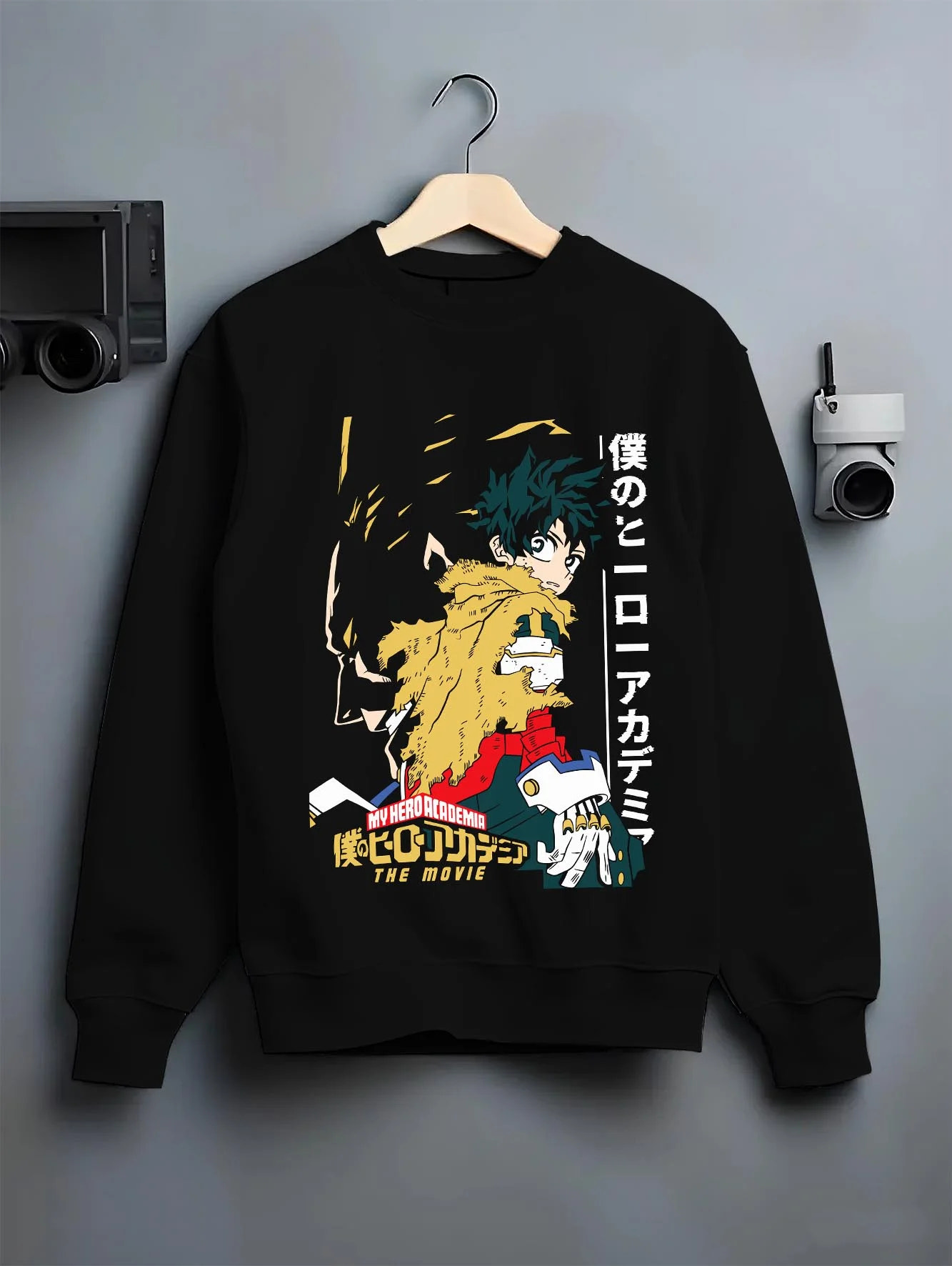 Black crewneck sweatshirt on hanger with Izuku Midoriya Hoodie My Hero Academia Movie graphic bold anime graphic.