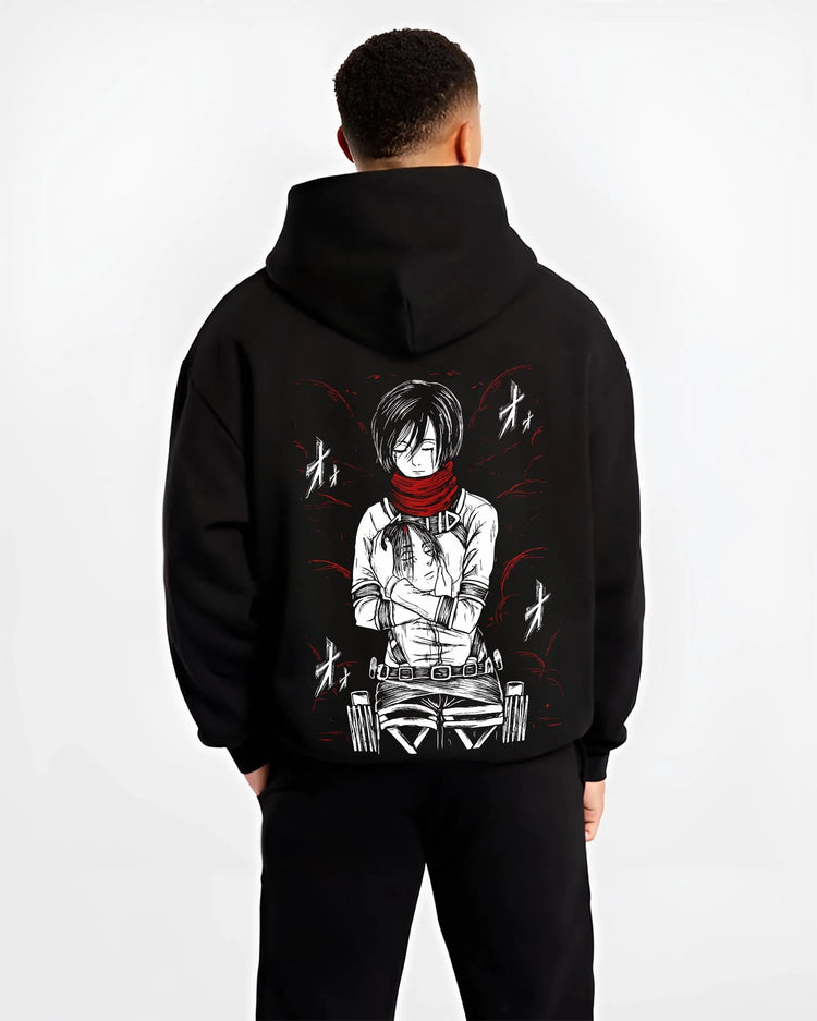 Black hoodie worn by male model, back view with Mikasa Ackerman Hoodie Attack on Titan Winter Gear graphic streetwear graphic.