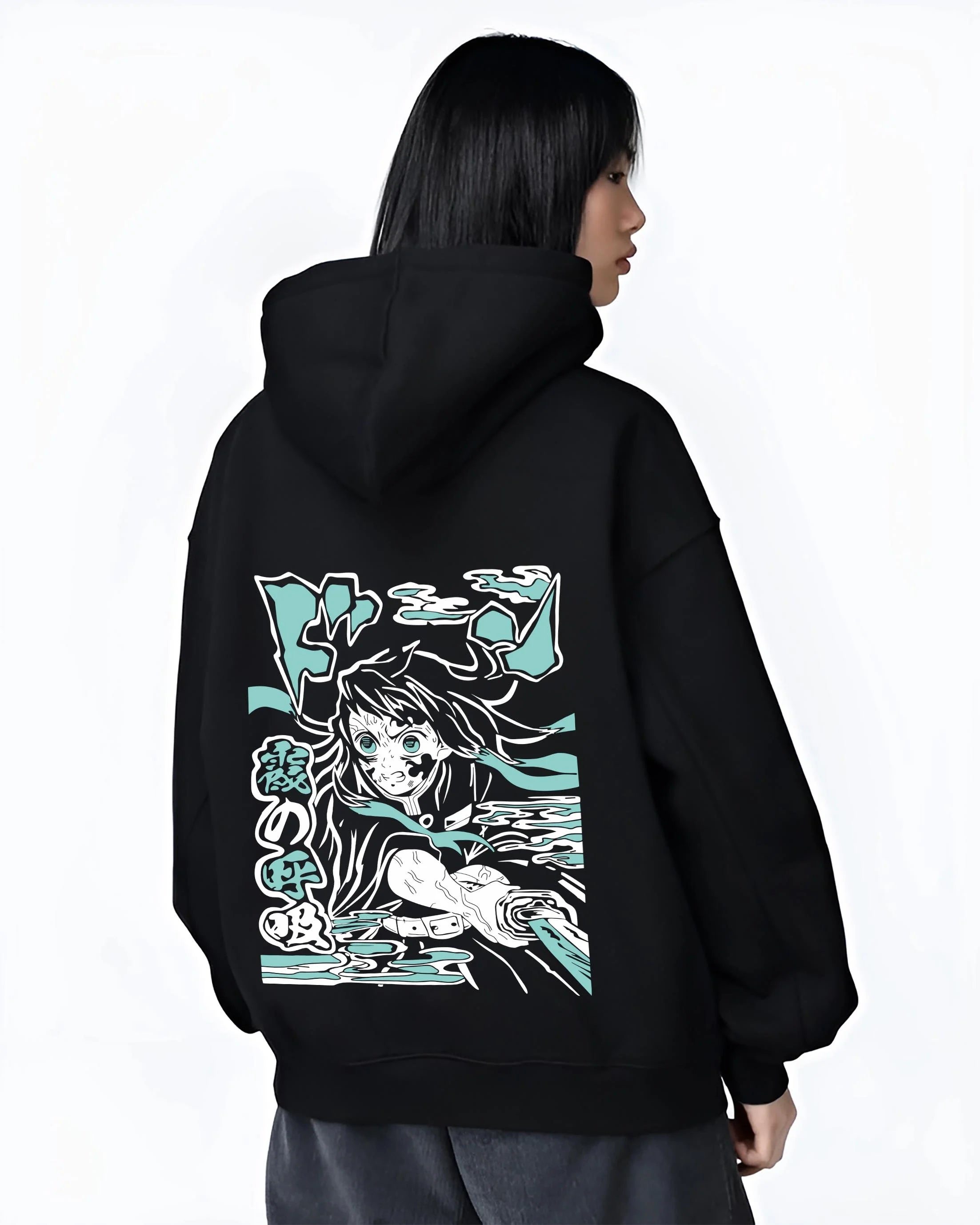 Black hoodie worn by female model, back view with Nezuko Kamado Hoodie Demon Slayer Transformation graphic bold anime graphic.