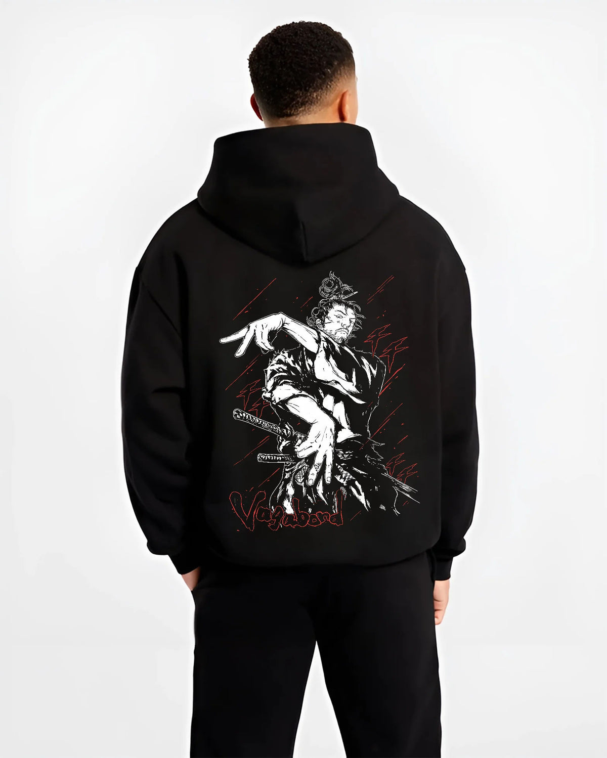 Black hoodie model back view showing Miyamoto Musashi from Vagabond: sword action scene