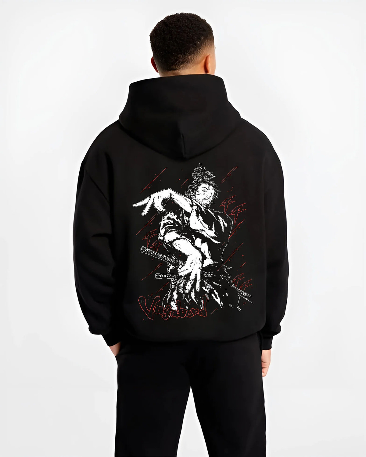 Black hoodie model back view showing Miyamoto Musashi from Vagabond: sword action scene