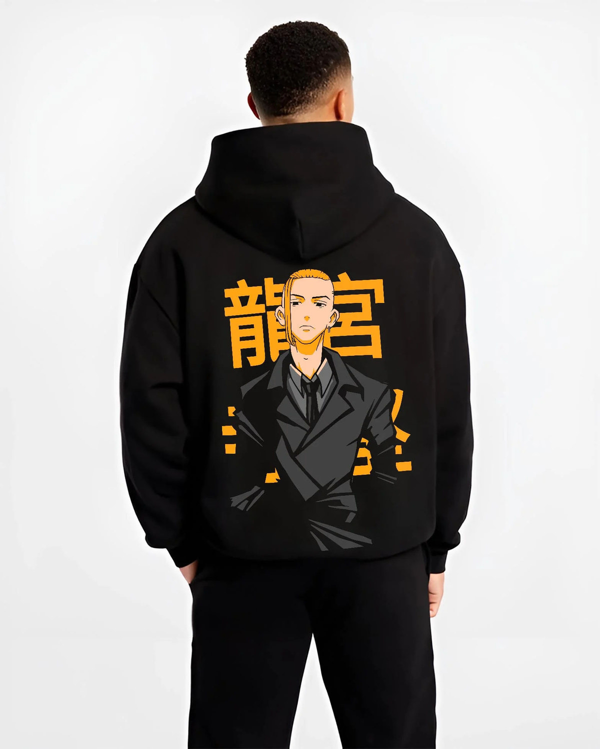 Black hoodie worn by male model from the back featuring Manjiro Sano Mikey Toman leader artwork.