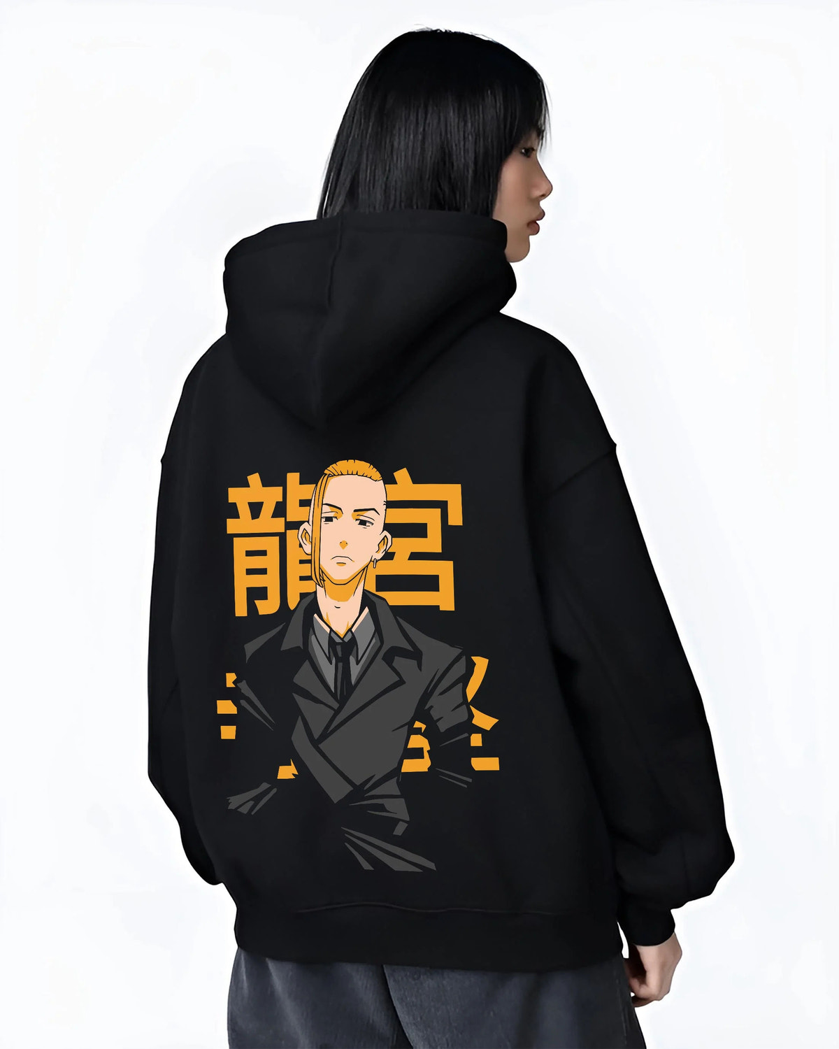 Black hoodie worn by female model from the back featuring Manjiro Sano Mikey Toman leader artwork.