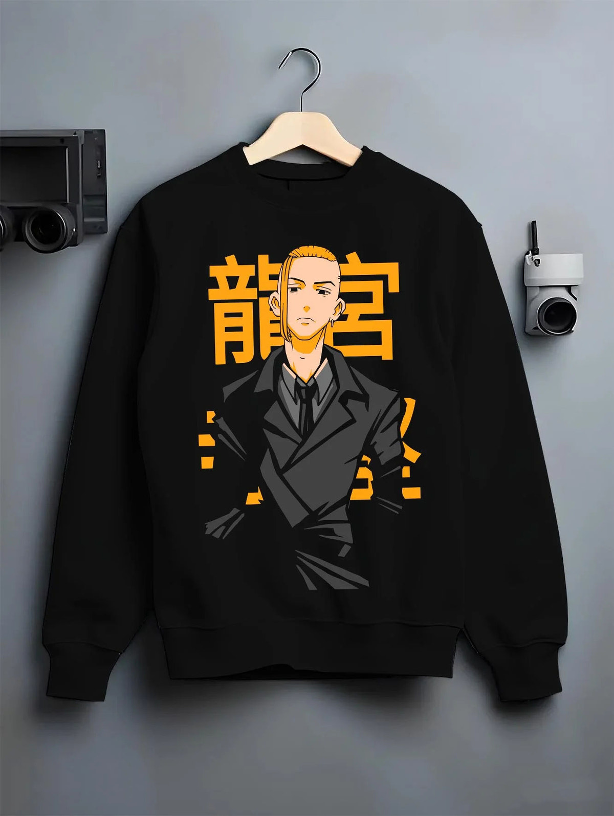 Black crewneck sweatshirt on hanger featuring Manjiro Sano Mikey Toman leader artwork.