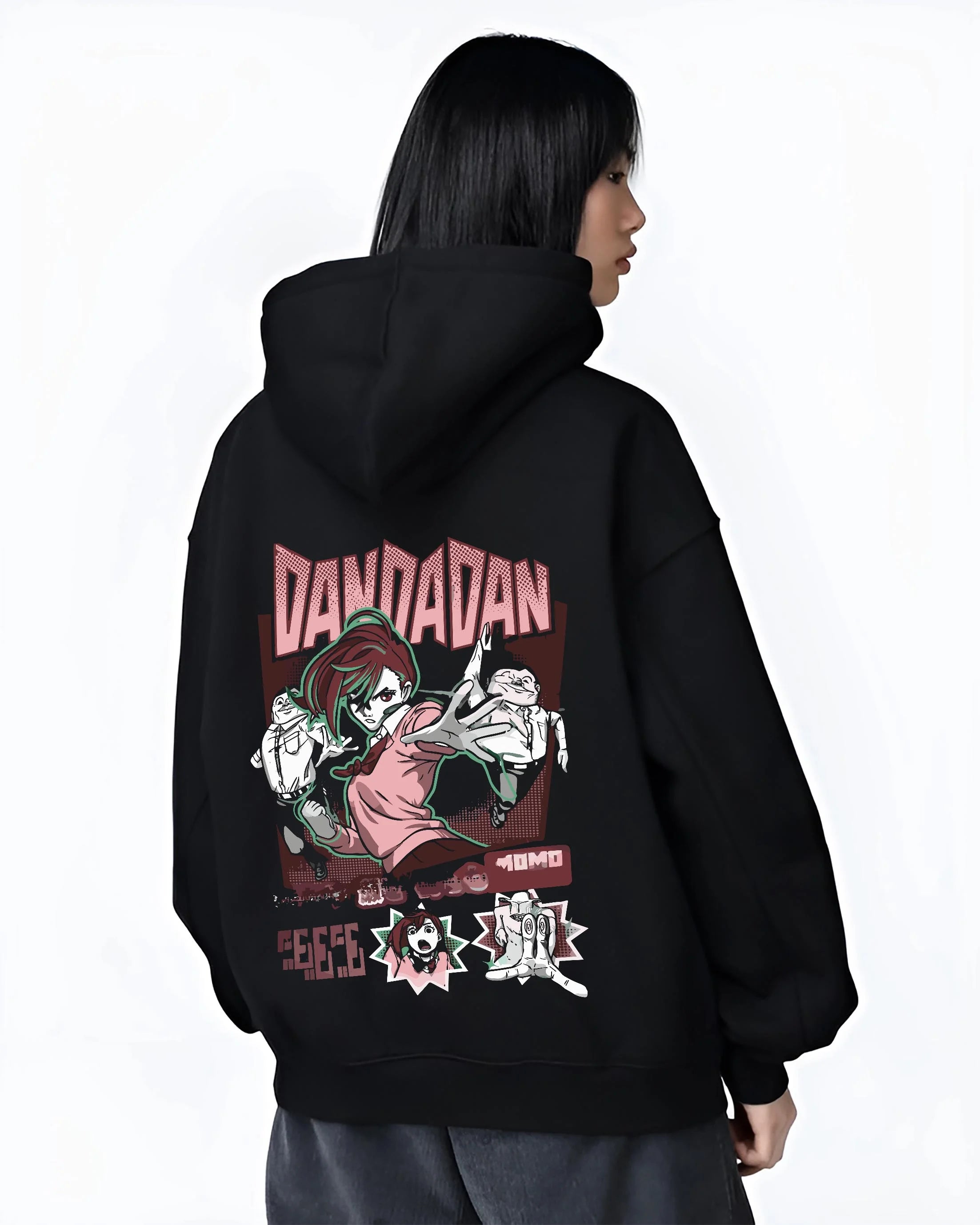 Black hoodie worn by female model, back view with Okarun Hoodie Dandadan Paranormal Spirit Battle graphic bold anime graphic.