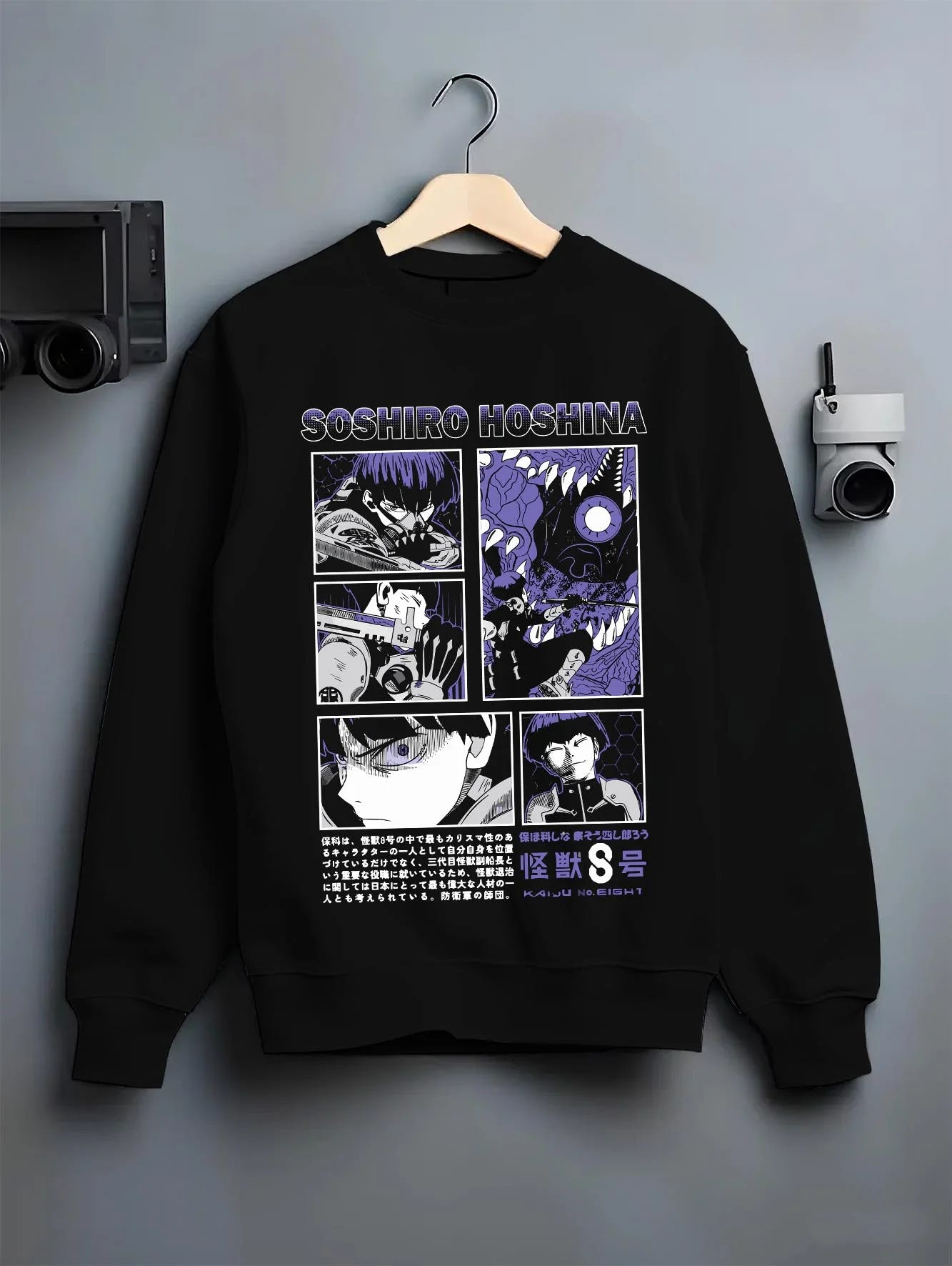 Black crewneck sweatshirt on hanger with Soshiro Hoshina Hoodie Kaiju No. 8 Battle Panel graphic streetwear graphic.