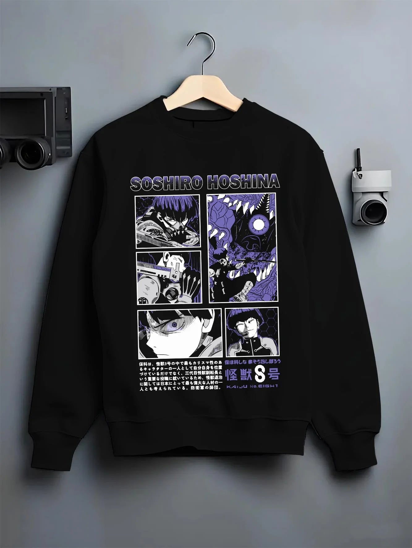 Black crewneck sweatshirt on hanger with Soshiro Hoshina Hoodie Kaiju No. 8 Battle Panel graphic streetwear graphic.