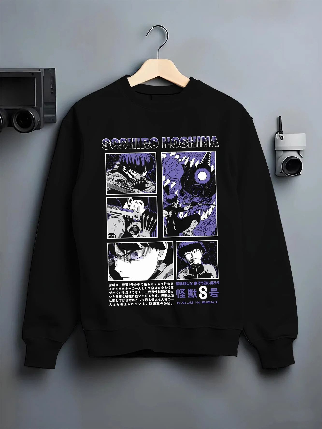 Black crewneck sweatshirt on hanger with Soshiro Hoshina Hoodie Kaiju No. 8 Battle Panel graphic streetwear graphic.