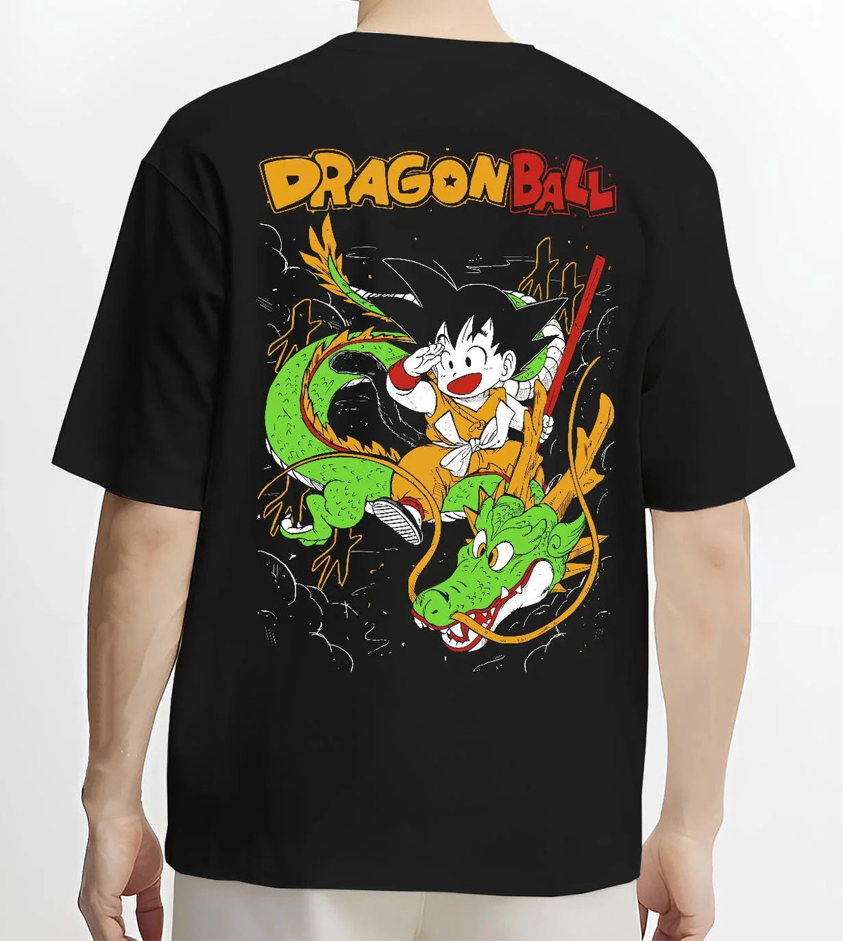 Black T-shirt worn by male model from the back featuring Kid Goku and Shenron artwork.