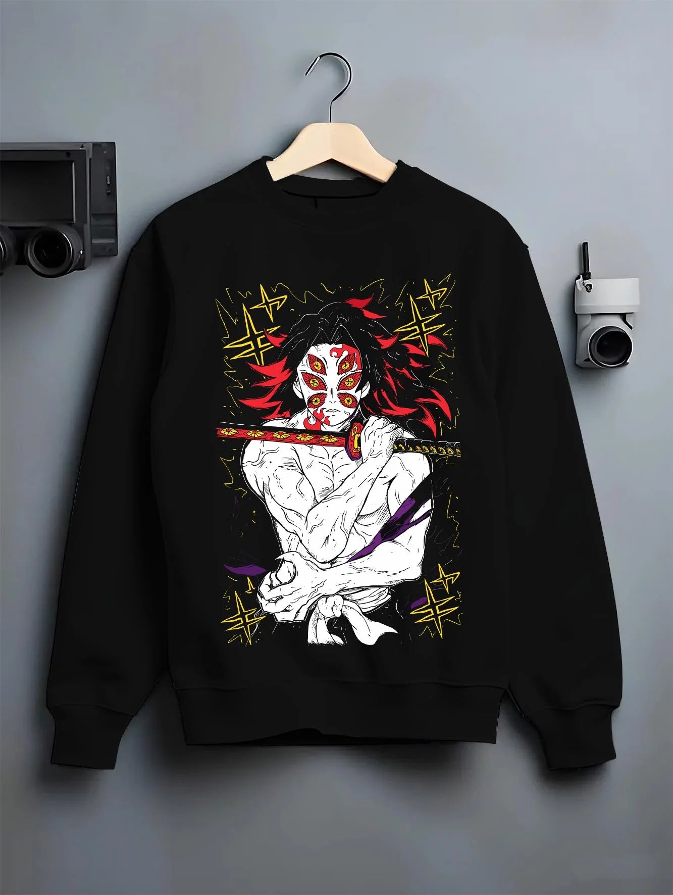 Black crewneck sweatshirt on hanger with Kokushibo Hoodie Demon Slayer Crescent Marked graphic premium wear.