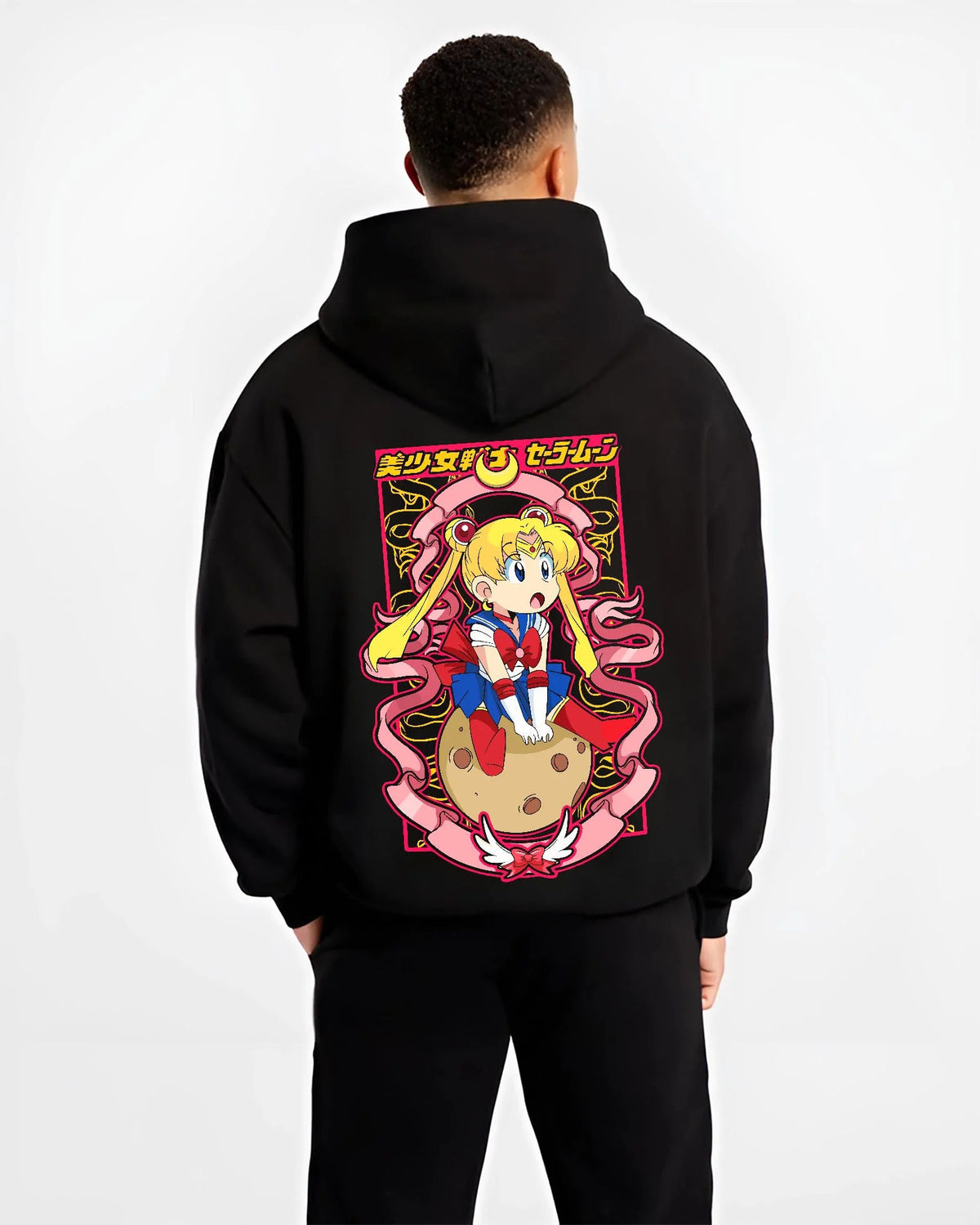 Black hoodie worn by male model from the back featuring Sailor Moon Eternal form artwork.