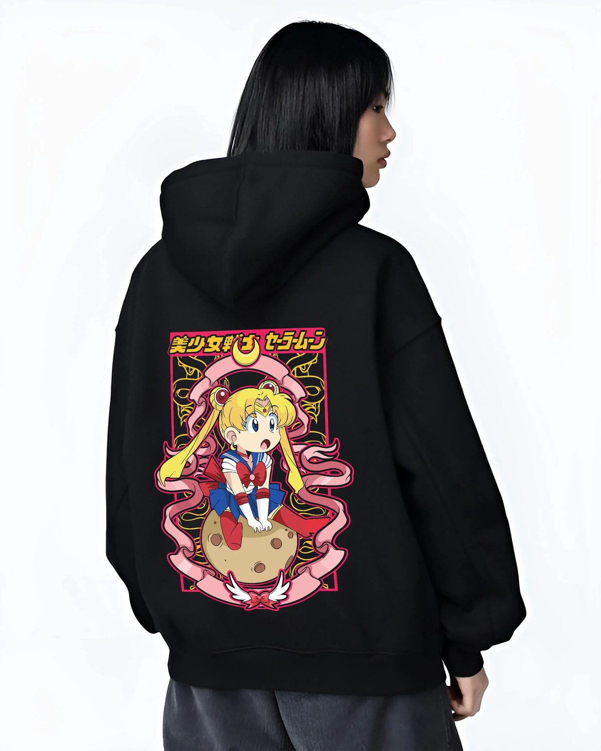 Black hoodie worn by female model from the back featuring Sailor Moon Eternal form artwork.