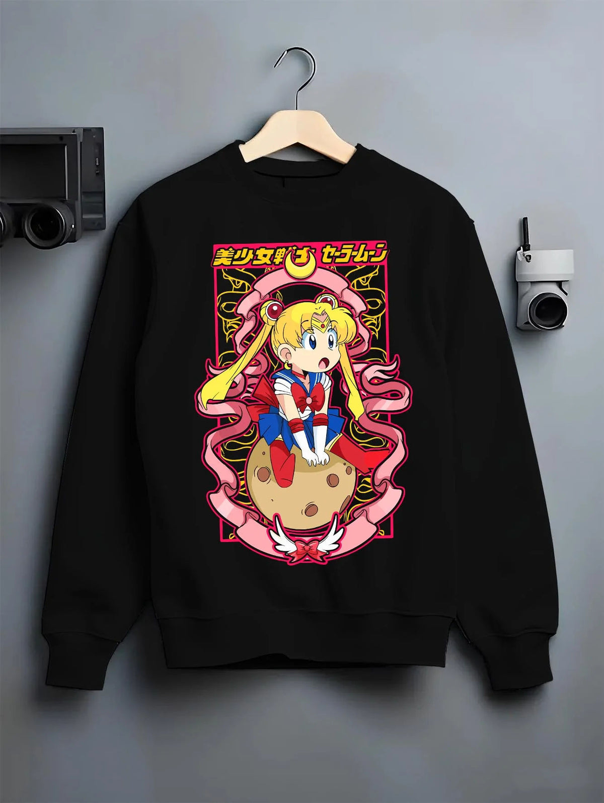 Black crewneck sweatshirt on hanger featuring Sailor Moon Eternal form artwork.