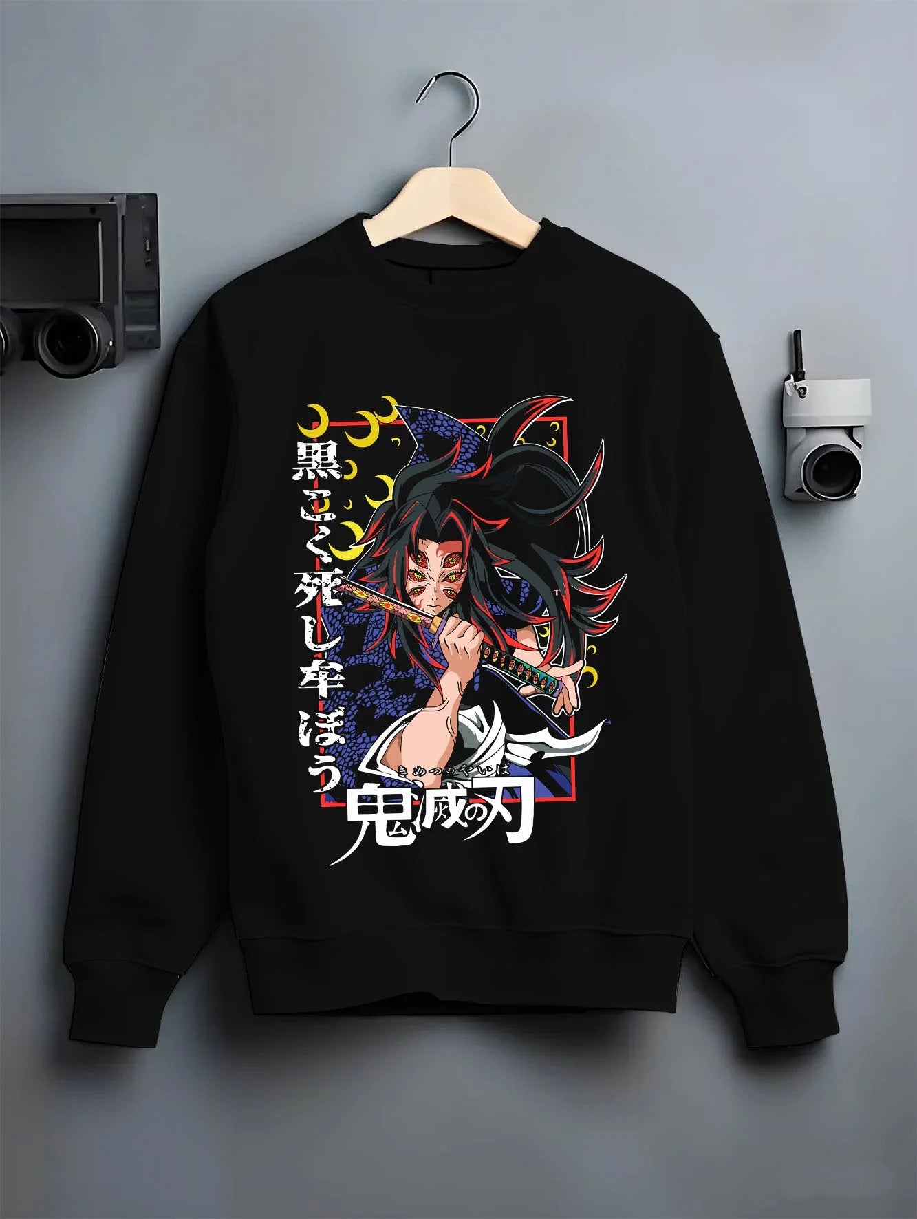 Black crewneck sweatshirt on hanger with Kokushibo Hoodie Demon Slayer Tragic Moon Form graphic streetwear graphic.