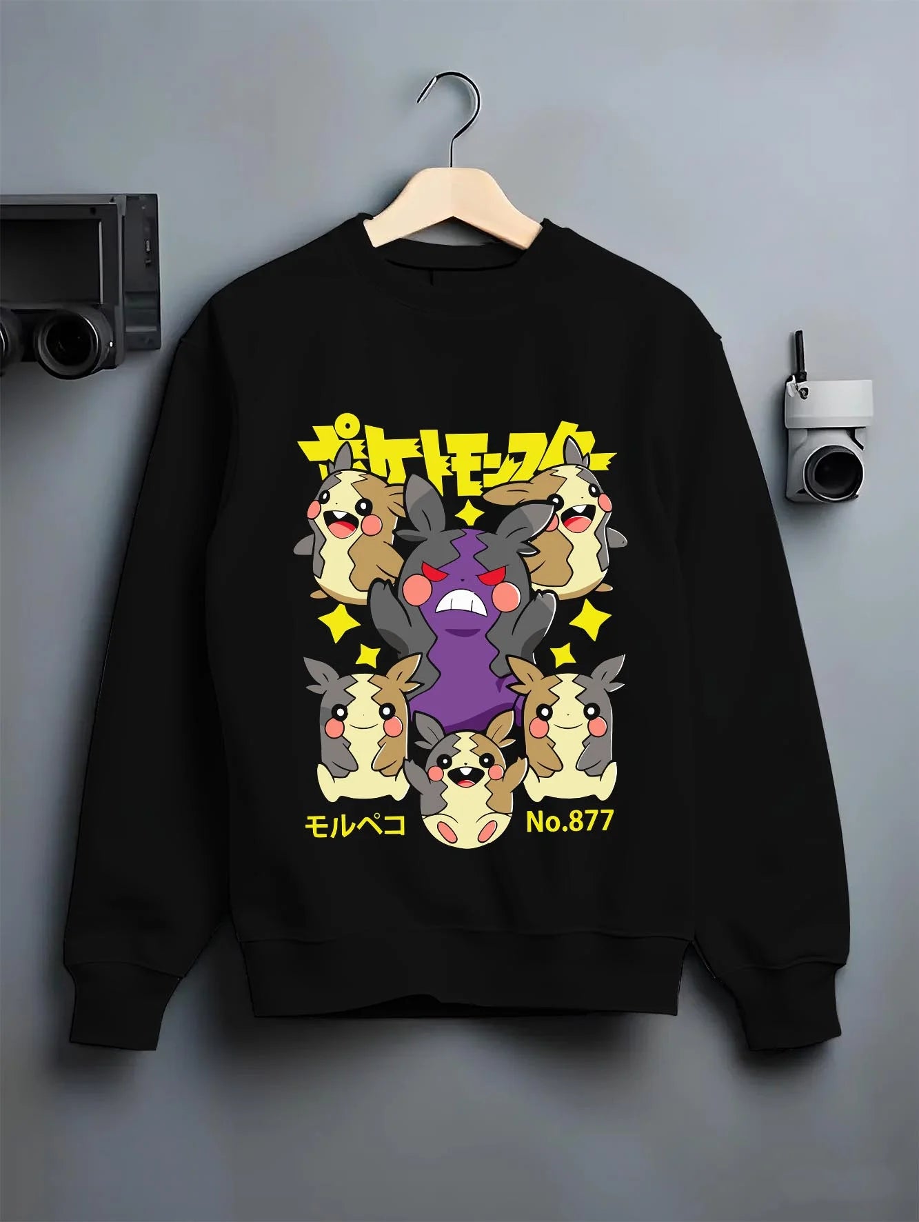 Black crewneck sweatshirt on hanger with Morpeko Hoodie Pokémon Character Evolution graphic premium wear.