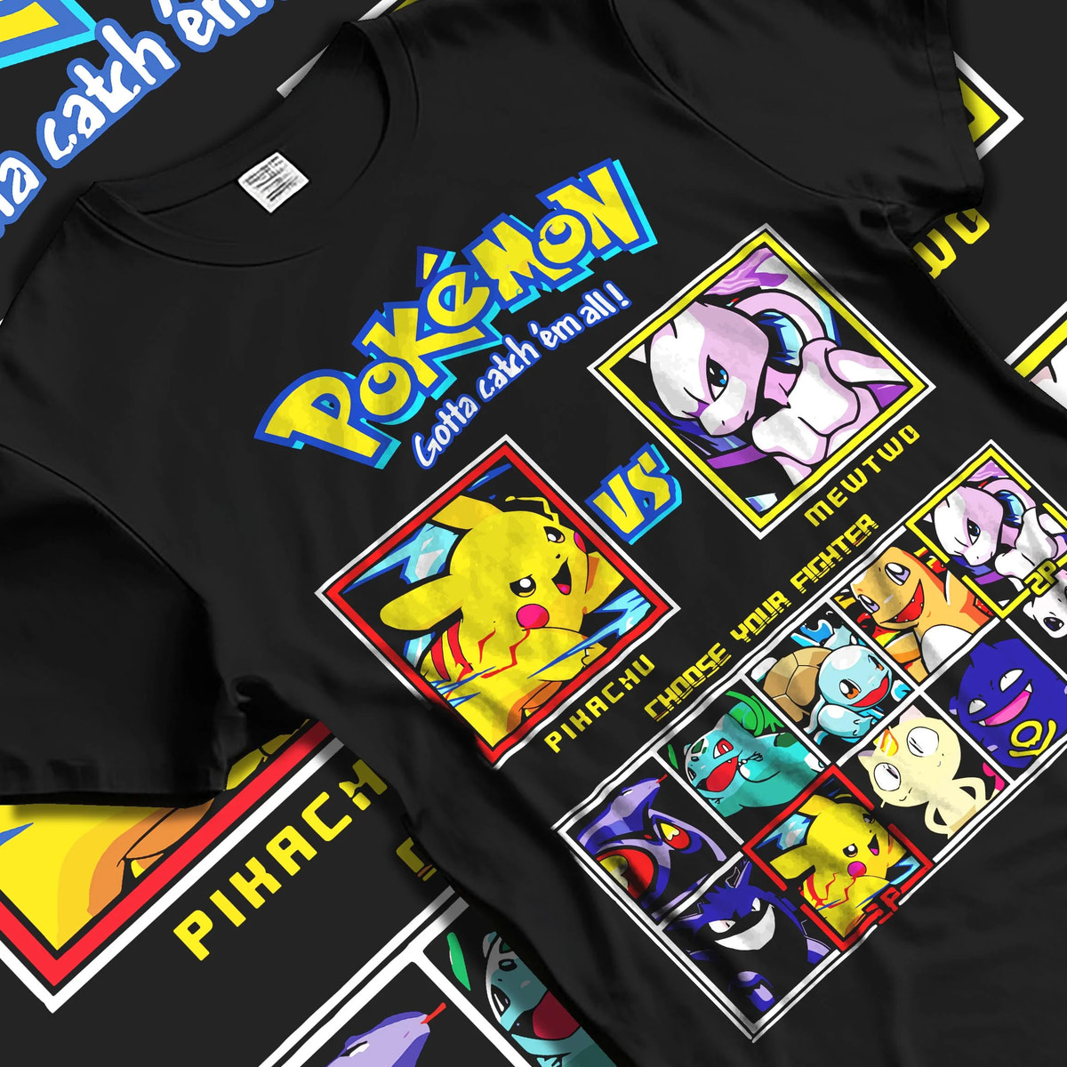 Black T-shirt laid flat with natural folds featuring Pikachu, Mewtwo and classic Pokemon artwork.