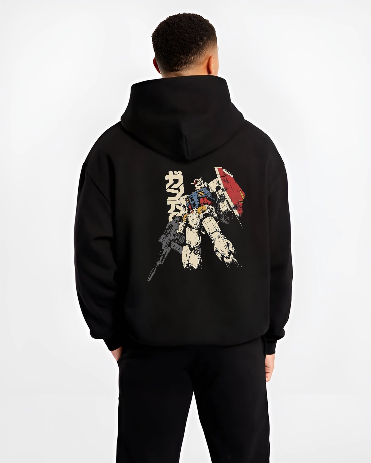 Black hoodie worn by a male model, back view, featuring Mobile Suit Gundam Japanese animation streetwear graphic with bold retro mecha manga design artwor