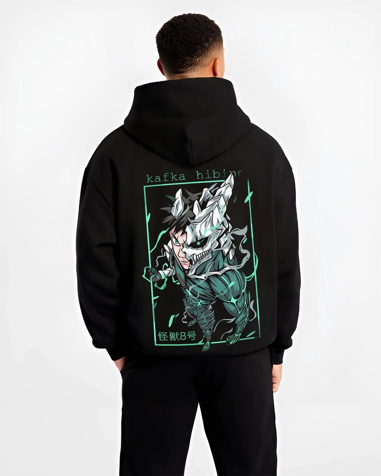 Black hoodie worn by male model, back view with Kafka Hibino Hoodie Kaiju No. 8 Monster Form graphic bold anime graphic.