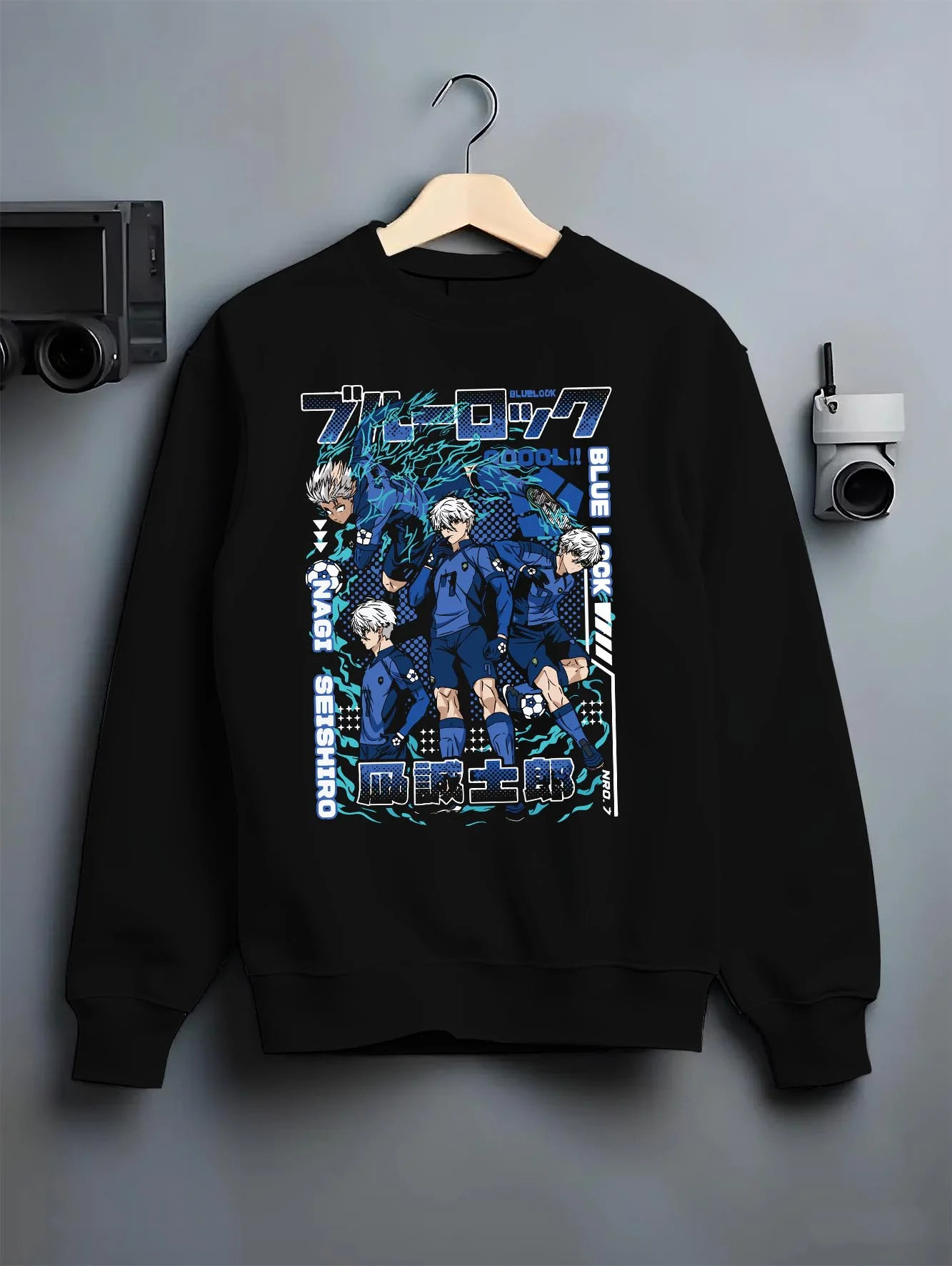 Black crewneck sweatshirt on hanger with Blue Lock Hoodie Nagi Reo Dynamic Striker Pair graphic streetwear graphic.