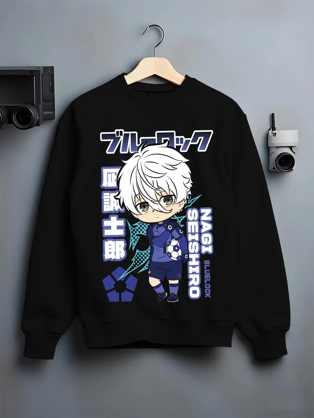 Black crewneck sweatshirt on hanger with Nagi Seishiro Hoodie Blue Lock Striker Icon graphic bold anime graphic.
