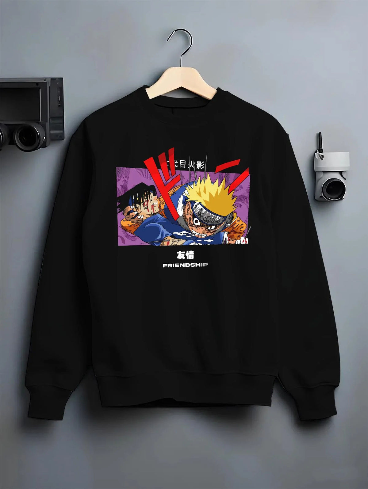 Black crewneck sweatshirt on hanger featuring Naruto and Sasuke friendship rivalry artwork.