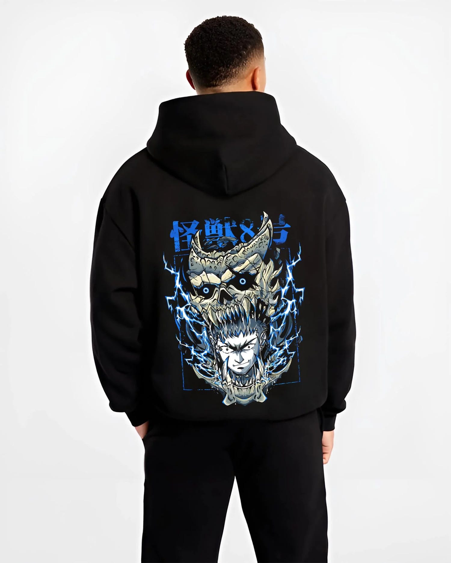 Black hoodie worn by male model, back view with Narumi Hoodie Kaiju No. 8 Skull Transformation graphic streetwear graphic.