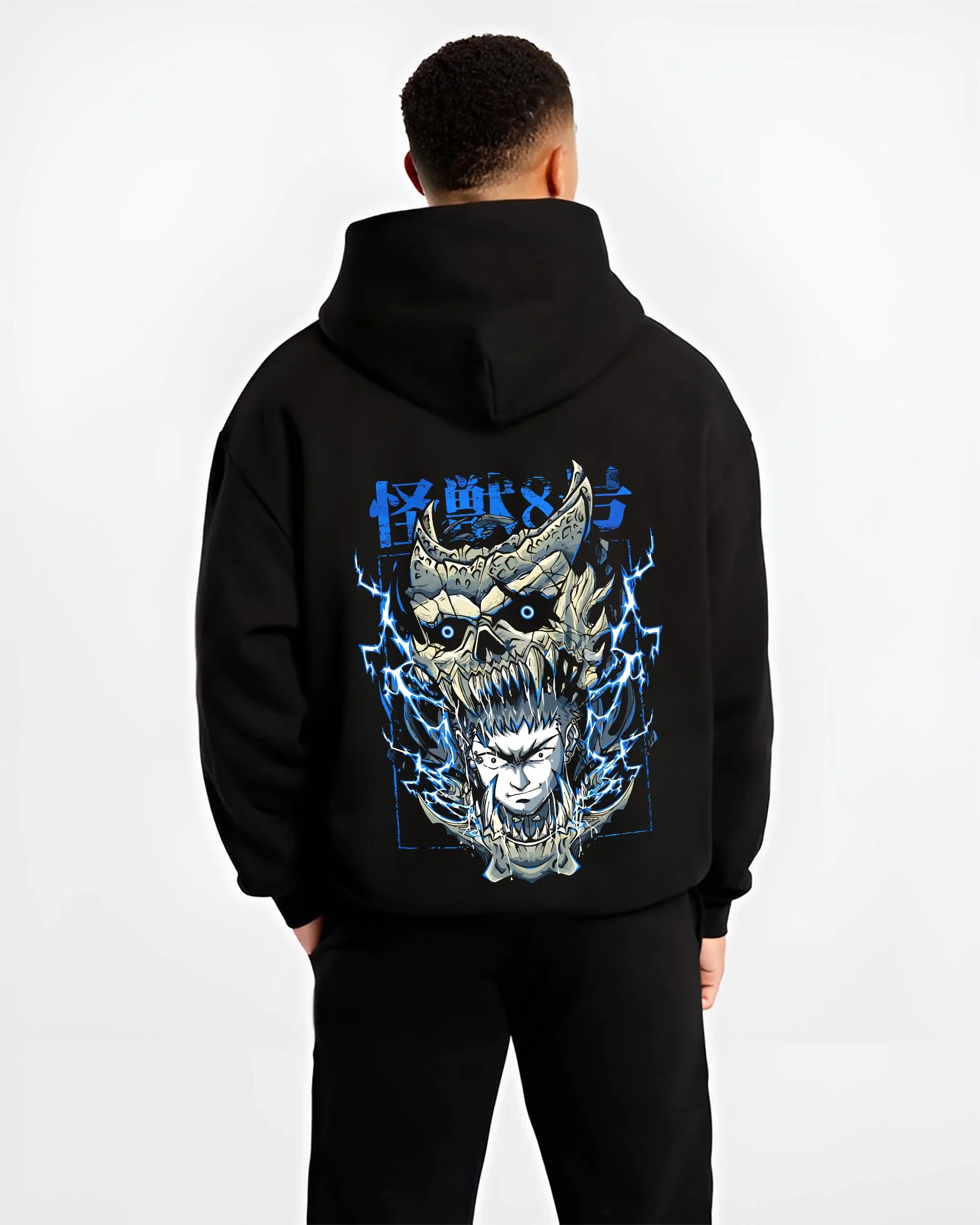 Black hoodie worn by male model, back view with Narumi Hoodie Kaiju No. 8 Skull Transformation graphic streetwear graphic.